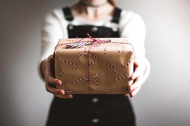 A girl holding a wrapped gift