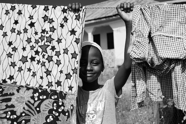 A child helping with laundry